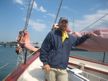 Argentinian guest enjoys a day sail in Newport Harbor- far away from the boat he captains in Tahiti