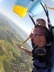 Hostel guest sky diving over Aquidneck Island with instructor