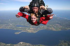 Hostel guests skydiving over Aquidneck Island